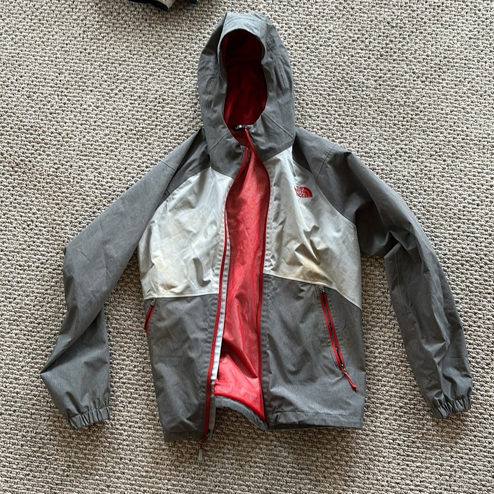 North face rain jacket. Works great but has a couple mud stains